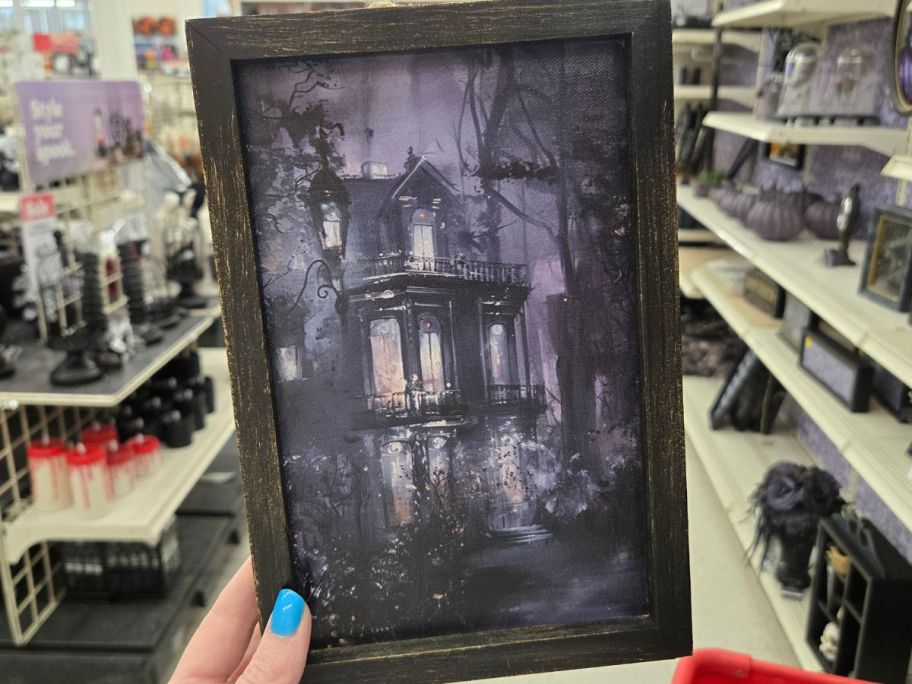 Haunted Mansion Wall Art in hand in store