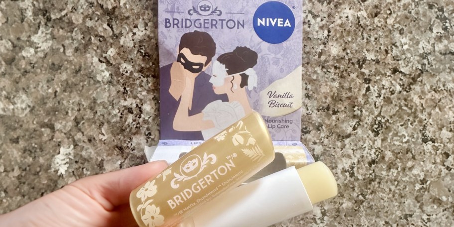 hand holding bridgerton nivea lip balms 