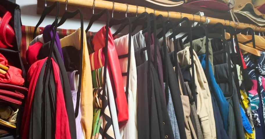 a closet with pants and leggings on space saving 5-pair pants hangers