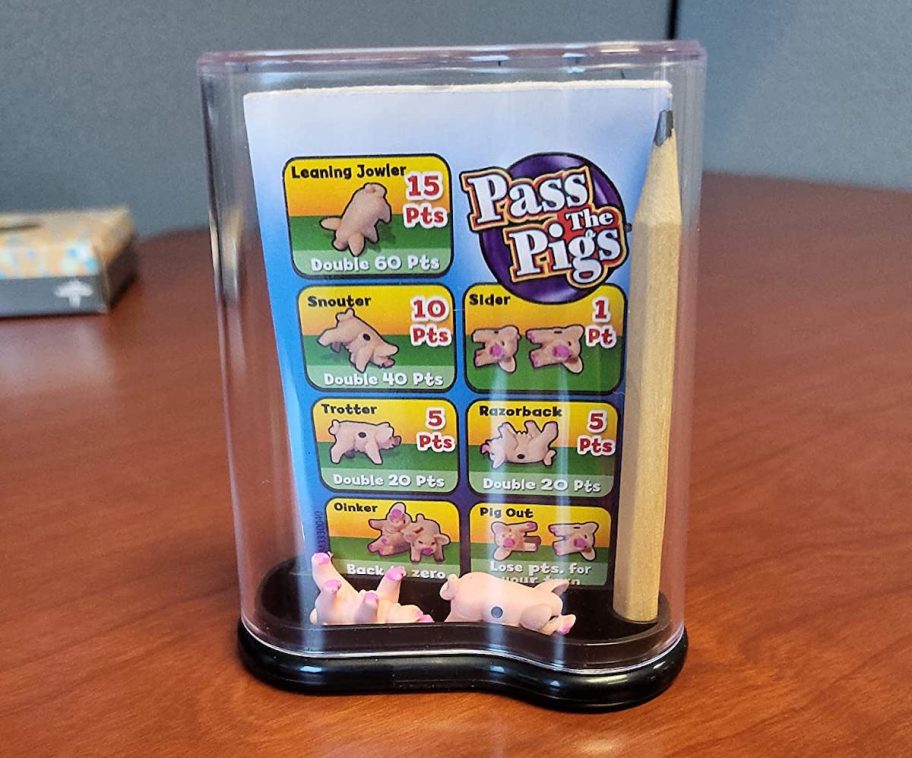 pass the pigs game on wood table