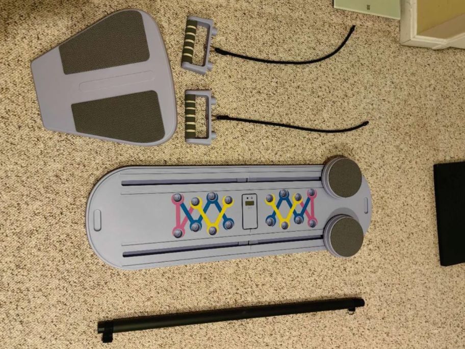 pilates board on floor with accessories