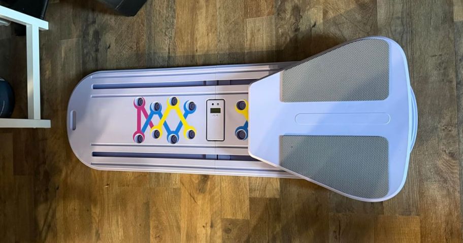 purple pilates board on floor