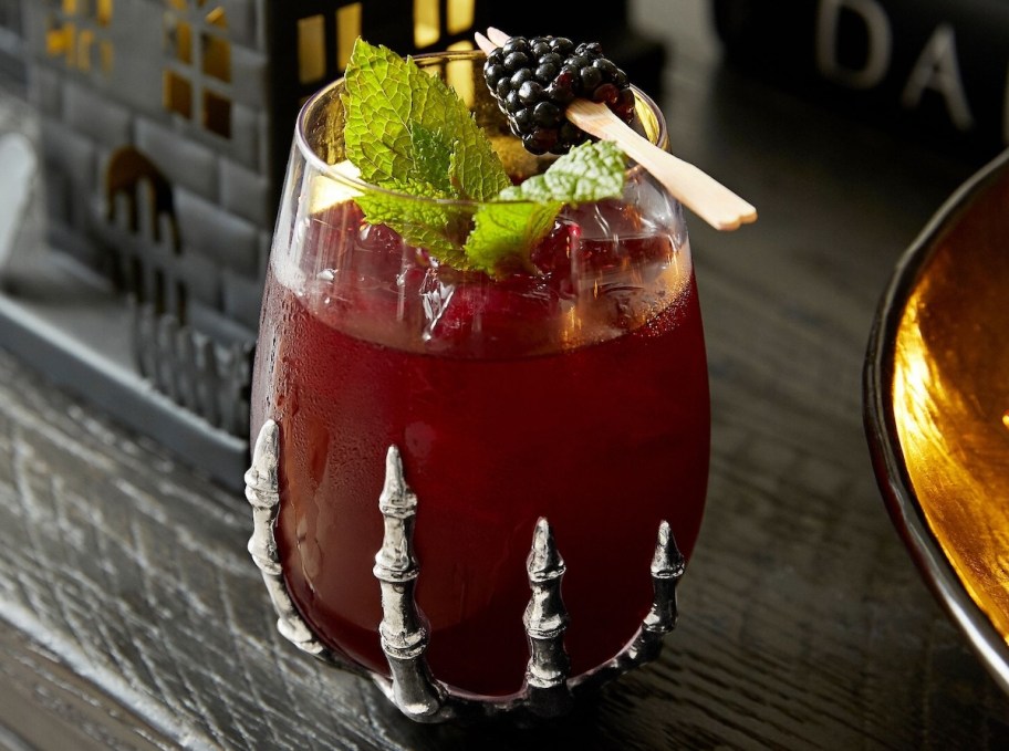 skeleton hand stemless wine glass with red cocktail