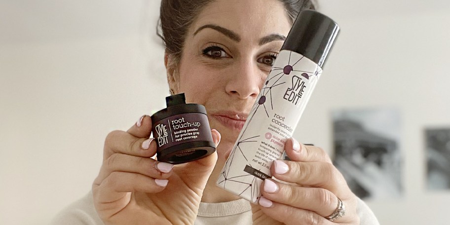 woman holding root touch up spray and powder 