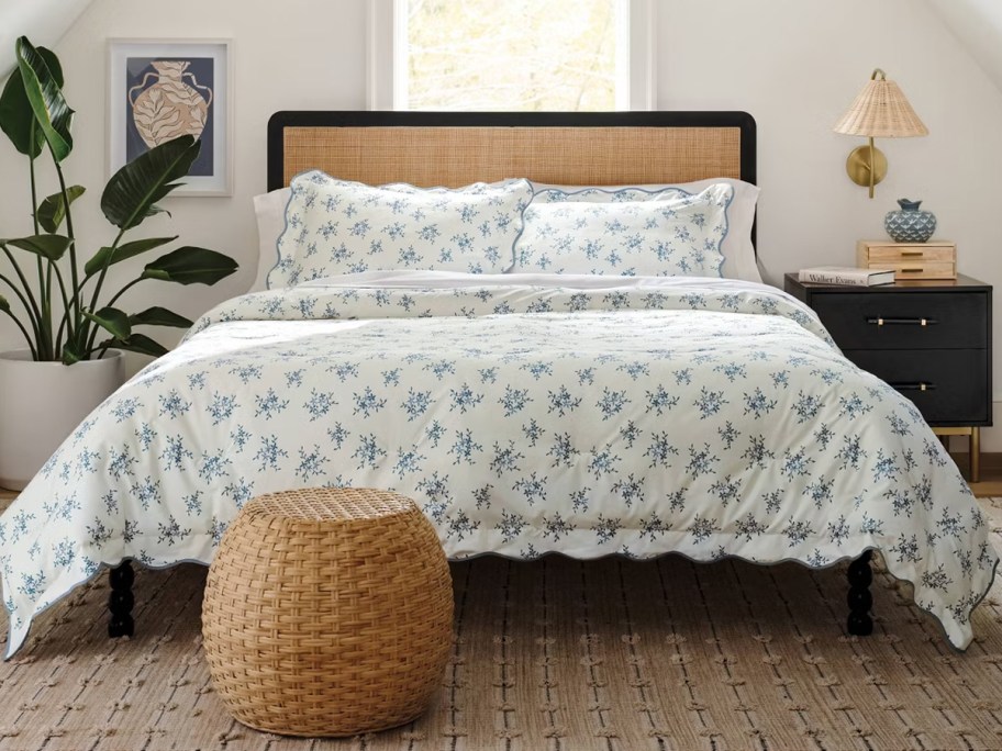 blue floral bedding on bed