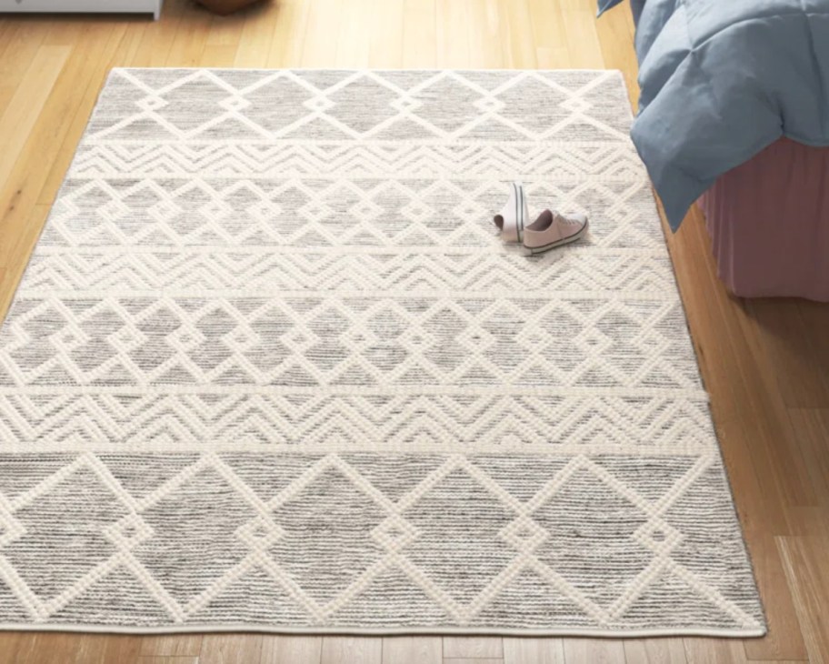 boho raised area rug next to bed