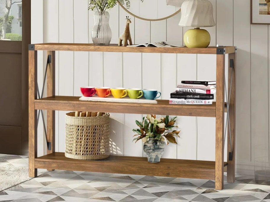 a wood console table in an entryway