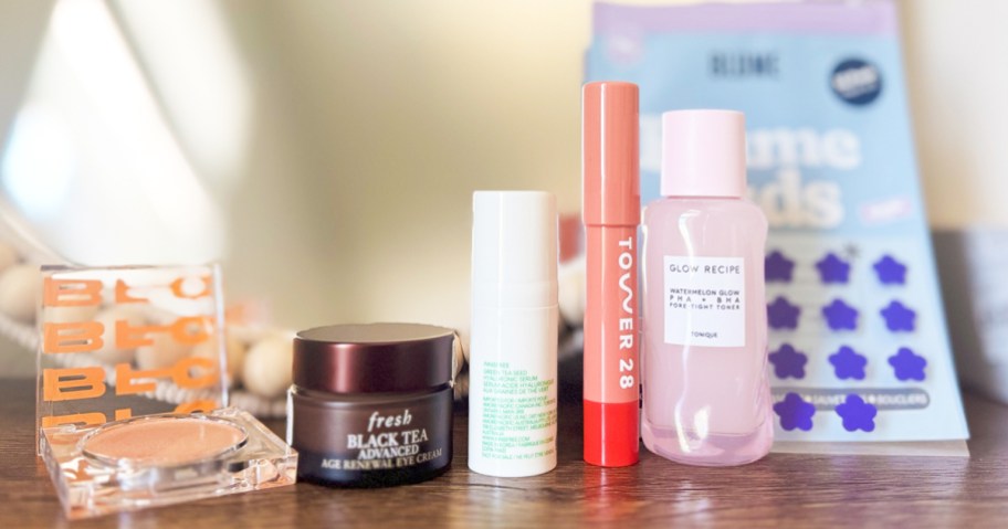 beauty products in a row on a table