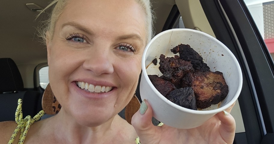 woman holding arby's steak nuggets in white container