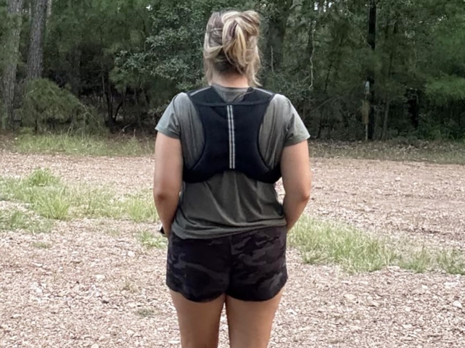 woman showing backside of weighted vest