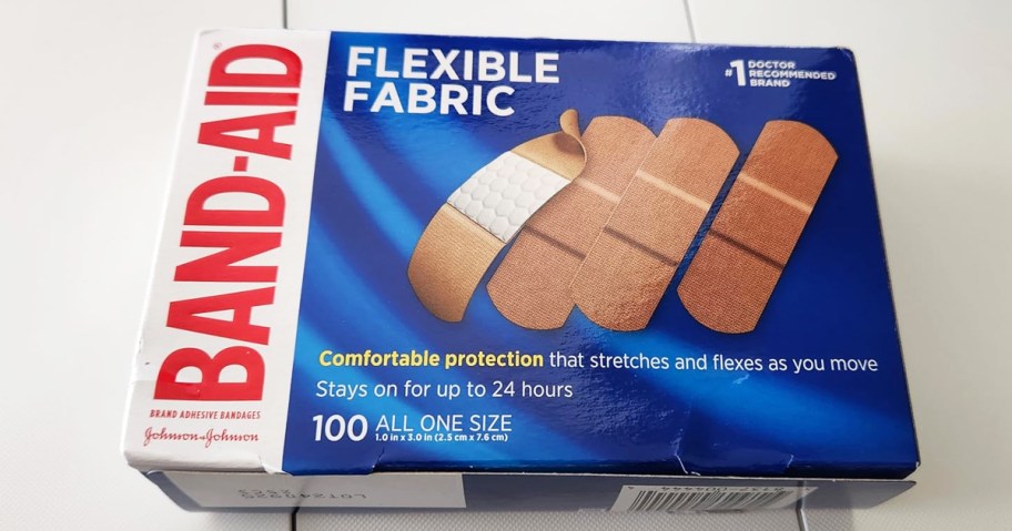 large box of Band-Aid Flexible Fabric Bandages on white table