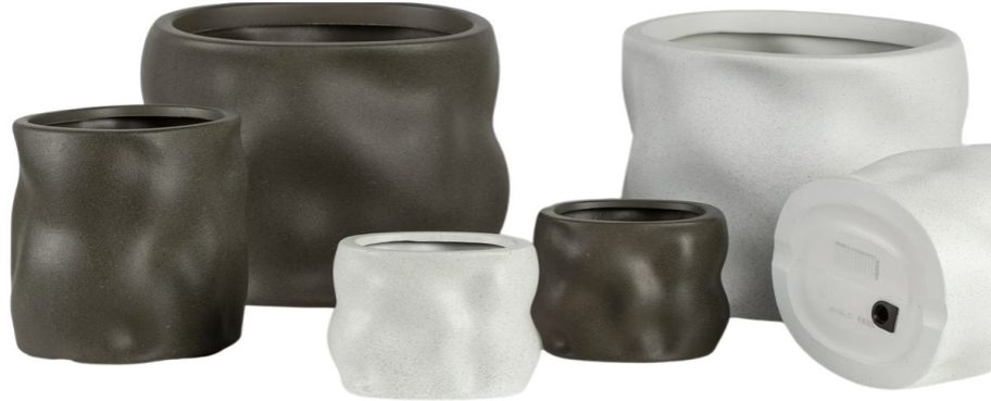 whaite and brown resin planters in different sizes