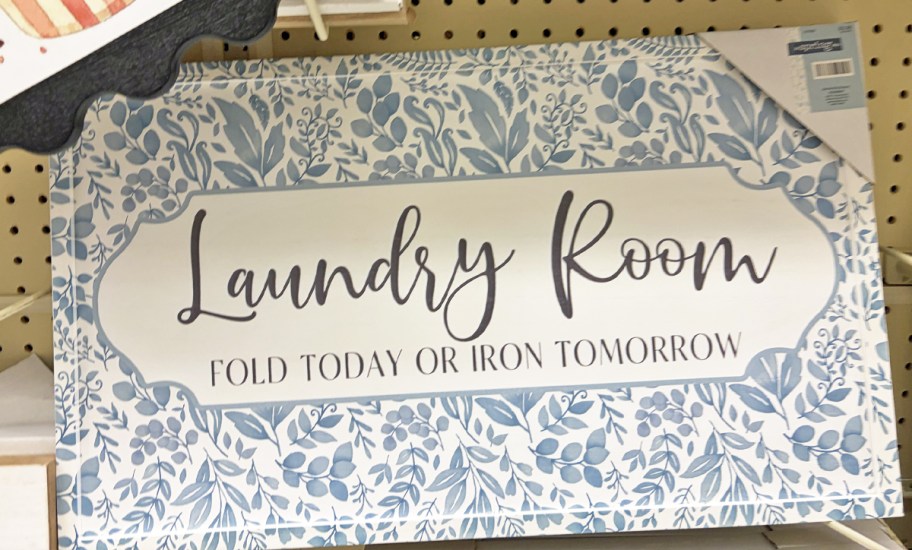 Blue Floral Laundry Room Wood Wall Decor on store display wall