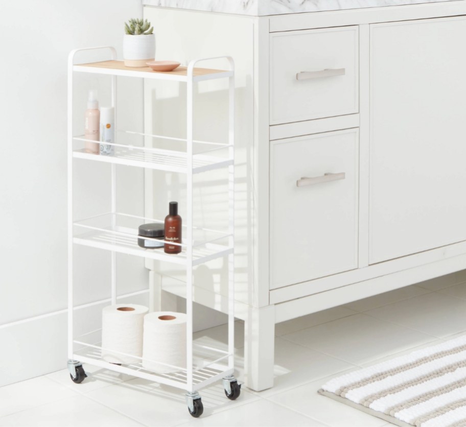 a white metal skinny rolling cart