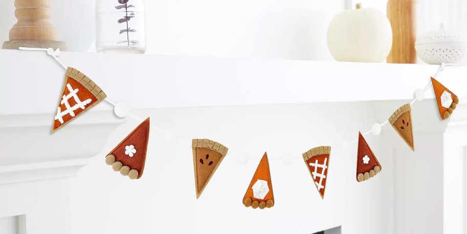 pie slice garland hanging from mantel 