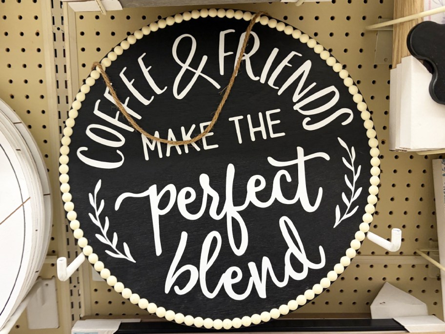 round wall sign that says coffee & friends make the best blend