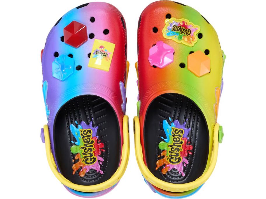 A multi-colored pair of crocs with Gusher's jibbitz