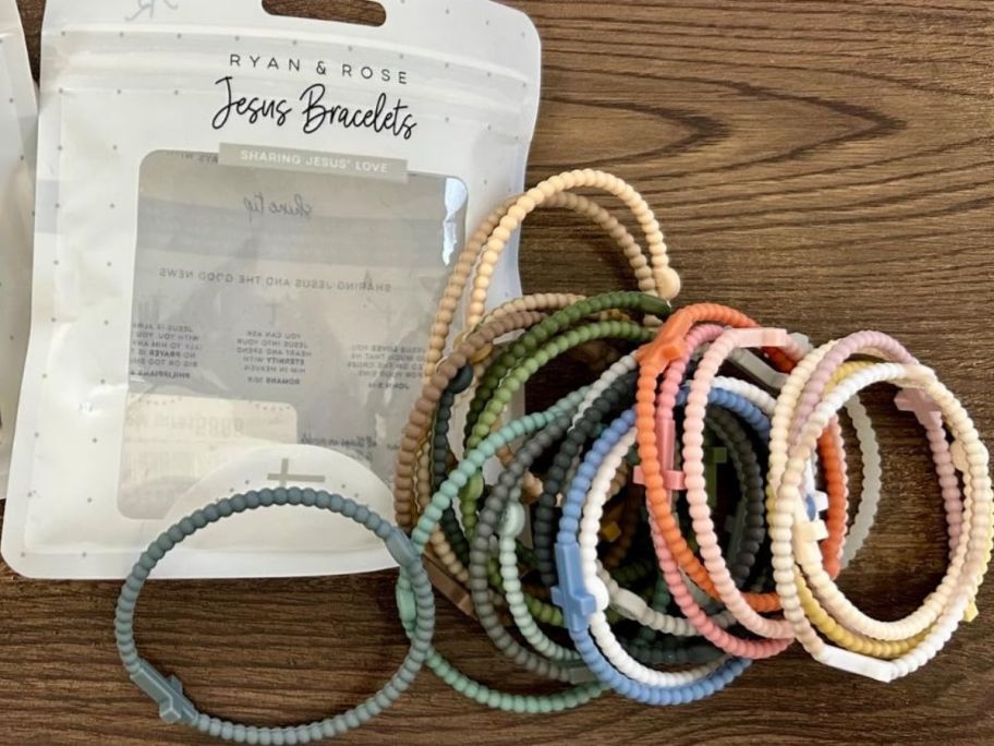 A 25-pack of silicone cross bracelets taken out of the bag they come in