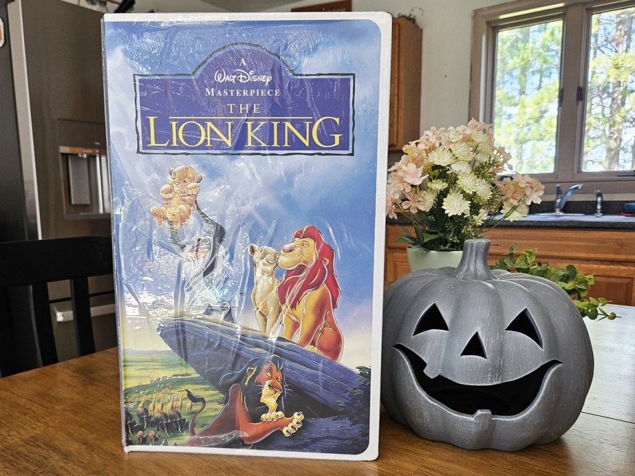 lion king VHS gift box on table near pumpkin