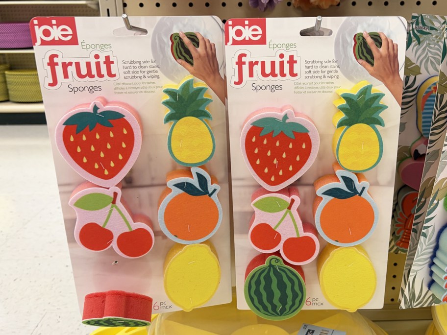 colorful fruit sponges hanging on store display