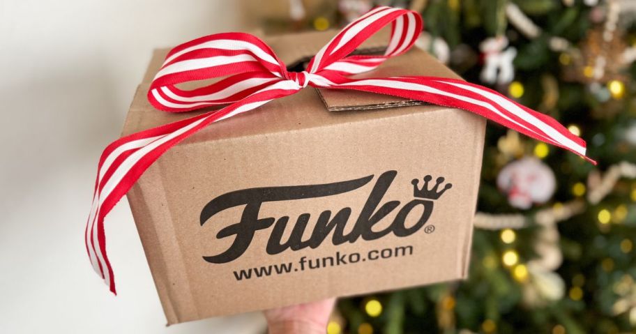 A Funko Box with a red bow on it