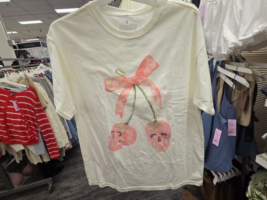 A woman holding a Women's Skulls Bow Graphic T-Shirt