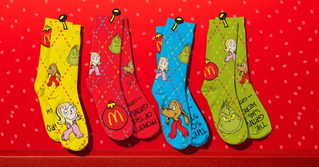 Grinch happy meal socks on red holiday background