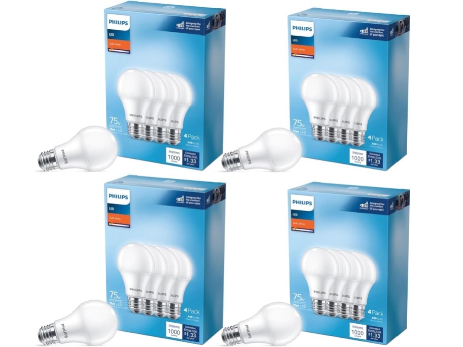 4 boxes of Philips 75 watt light bulbs with a single bulb in front of each