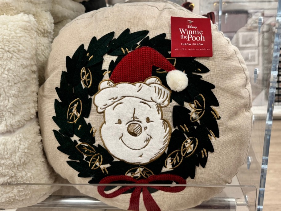 a Winnie the Pooh holiday wreath throw pillow
