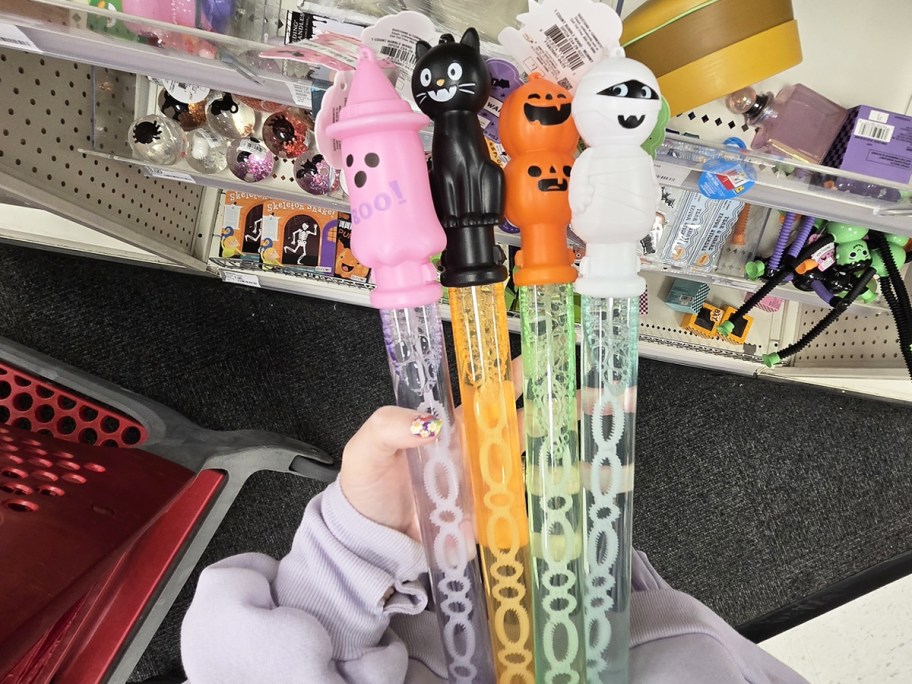 hand holding 4 Halloween Bubble Wands