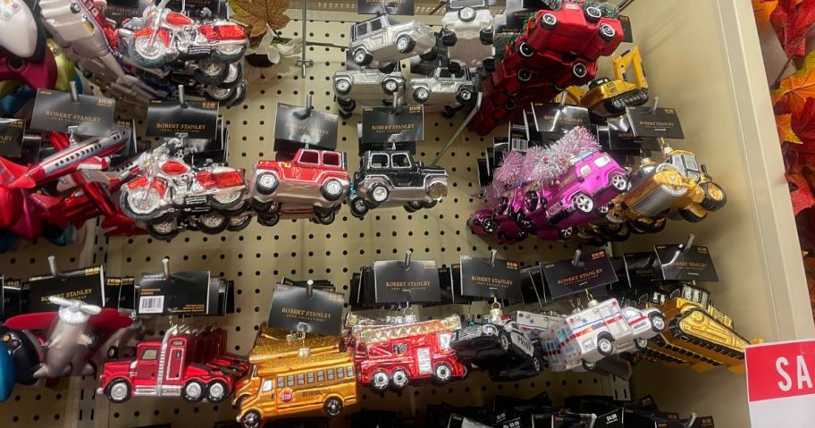 A wall full of vehicle ornaments in a store