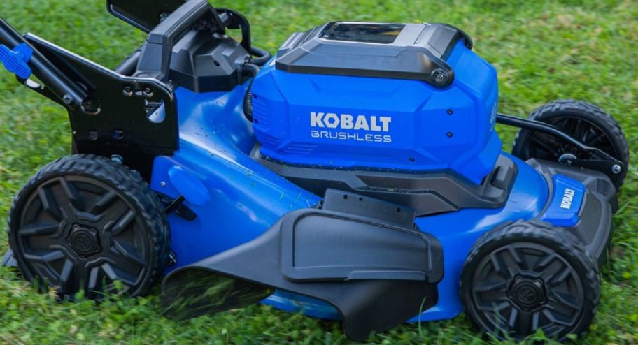 Kobalt Brushless Electric Lawn Mower in black and blue right on the grass