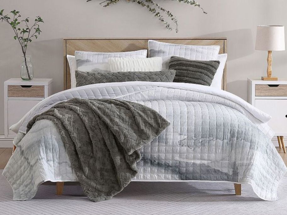 A bed with a Koolaburra by UGG Tanami Quilt Set