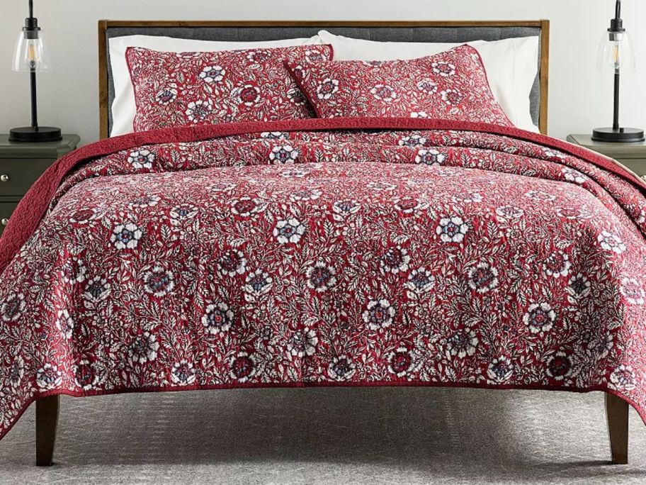 A bed with a. Sonoma Goods For Life Asma Floral Quilt set