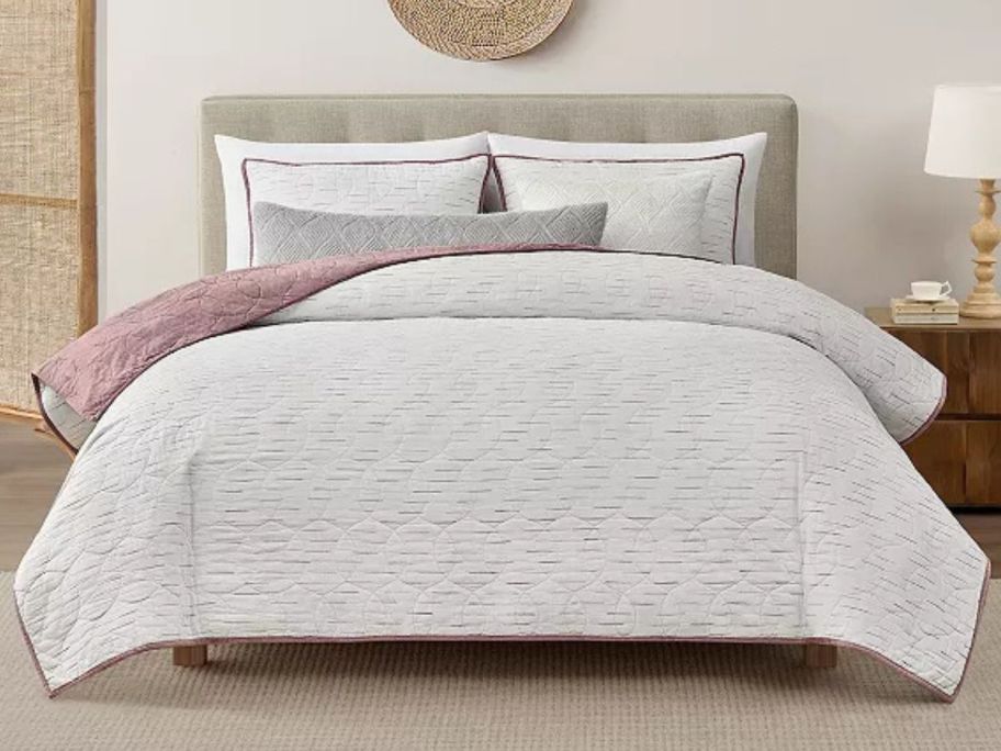 A bed with a Koolaburra by UGG Missy Quilt Set 