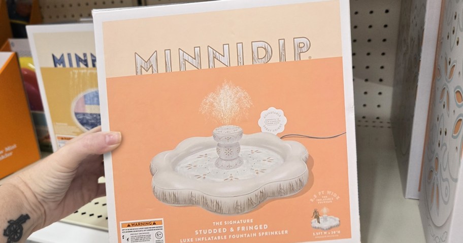 hand holding fountain shaped play sprinkler