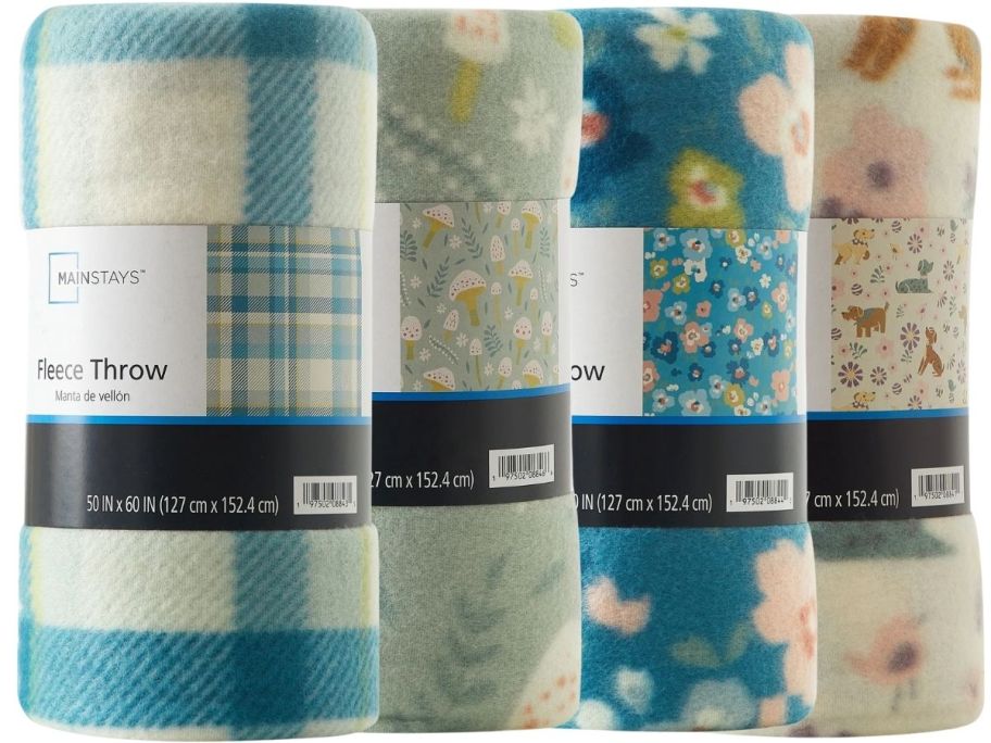 4 fleece blankets in various prints rolled up