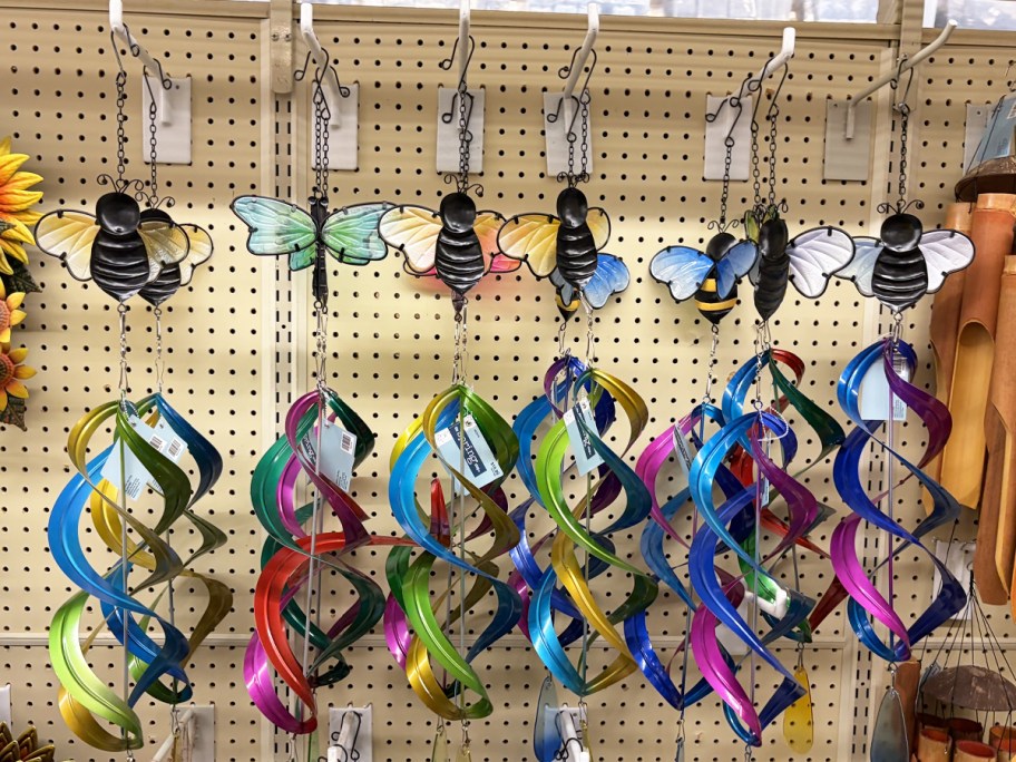 colorful Metal Wind Spinner Mobiles on store display wall