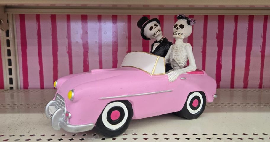 Skeleton figurines in a car