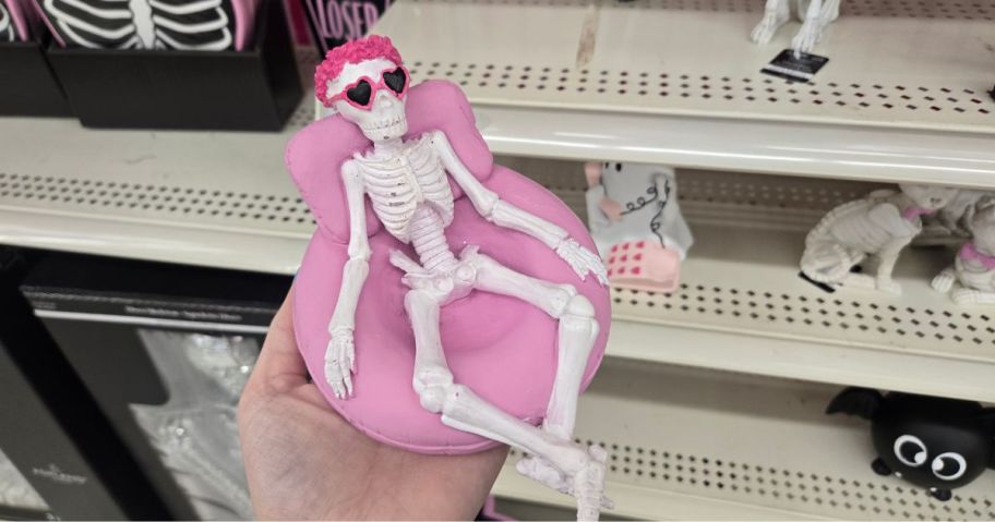 Skeleton figurines on a floating chair