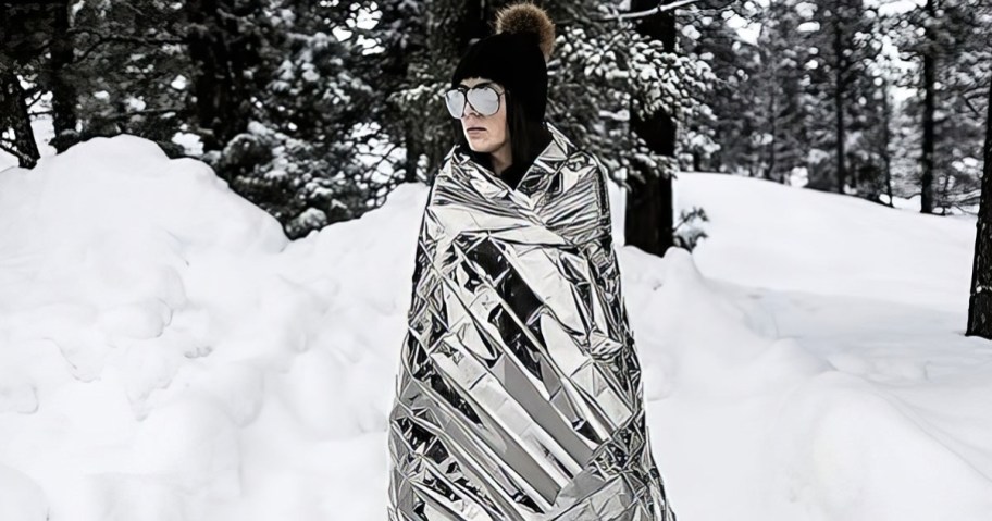 Mylar Emergency Blanket being worn by a woman in the snow