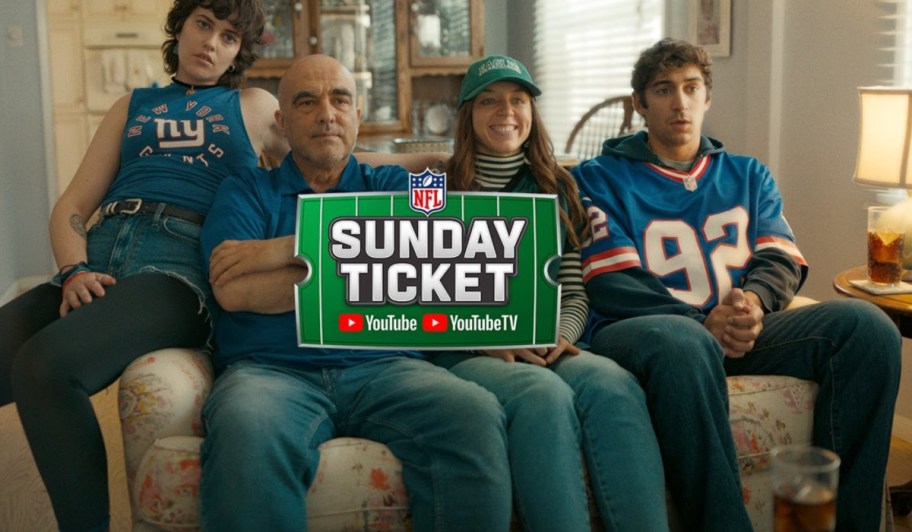 family sitting on a couch with sunday ticket