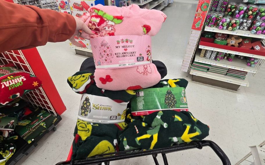 hand holding Oversized hoodie inside shopping cart