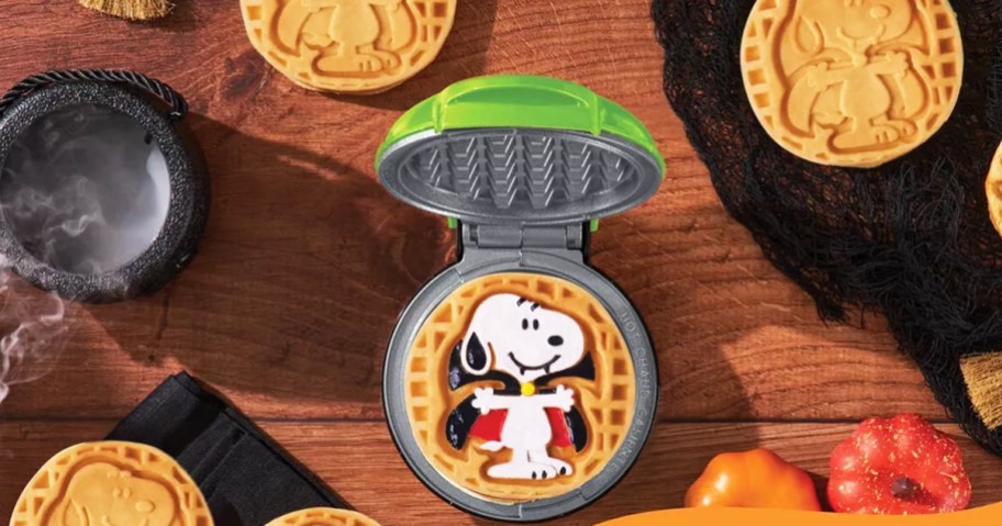 opened mini waffle maker with vampire snoopy waffle on it