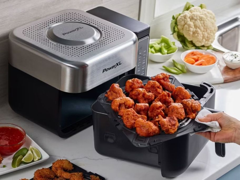 PowerXL air fryer with food inside of it 