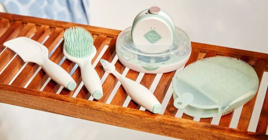 A baby's spa kit on a bamboo tray