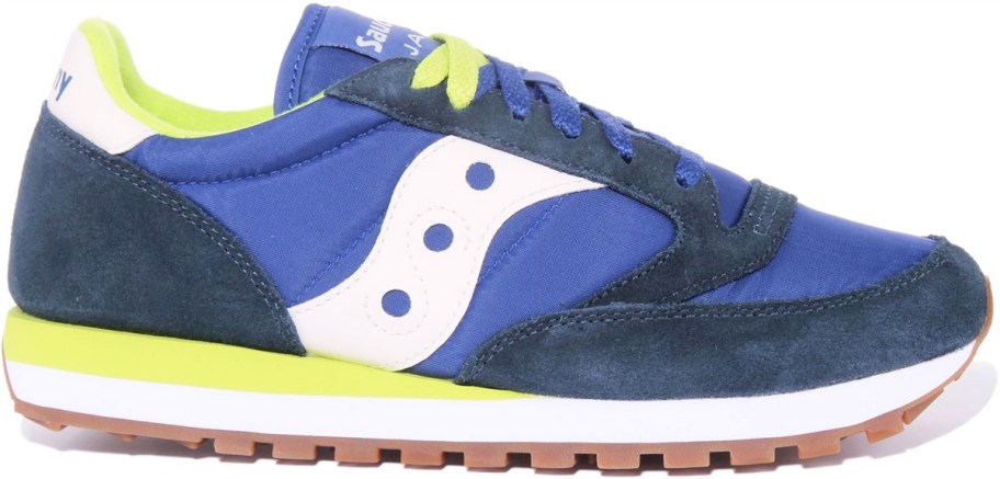 blue, green, and white runner shoe