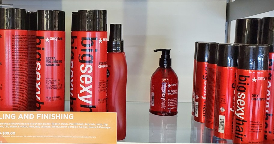 bottles of Sexy Hair shampoo, conditioner, and styling products on store shelf
