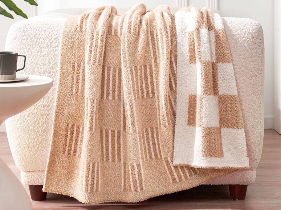 checkered throw blanket draped over a couch