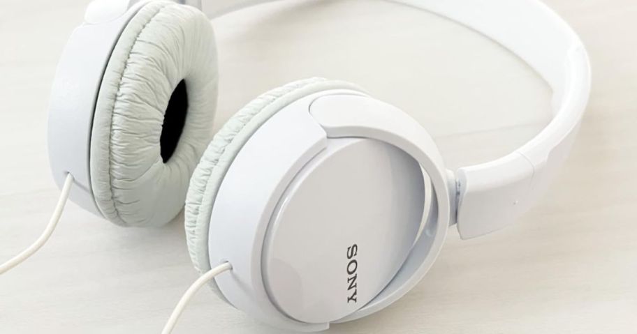 A pair of white sony wired earbuds